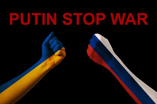 Fist fight flags of Ukraine and russia with text putin stop war on black background. Putin invasion
