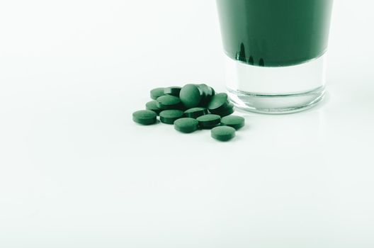 minimalist glass with water and spirulina powder. High quality photo