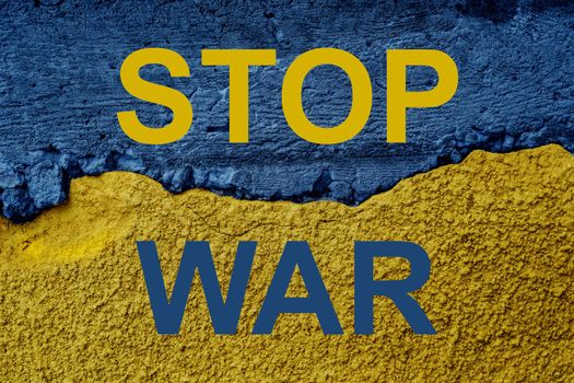 Ukrainian flag and text stop war on textured wall. Putin invasion. War against Ukraine.