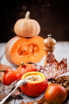 pumpkin cream soup in autumn scenery. High quality photo