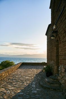 Church of St. John the Theologian at Kaneo, panoramic view at sunset, Ohrid, North Macedonia. High quality photo