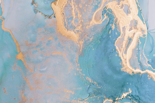 Abstract liquid ink painting background in pastel colors with gold splashes