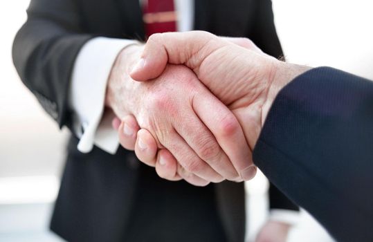 close up.handshake business partners.business concept