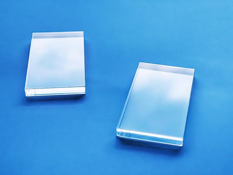 Glass device on blue background, future technology and abstract screen mockup design concept