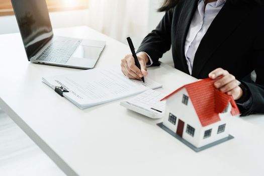 Law, agreement, contract, mortgage, woman holding a pen, reading the contract document in buying a house to see the interest rate and asking for the limit to assess the risk before buying a house.