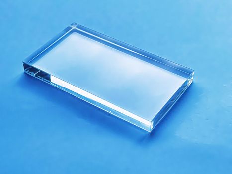 Glass device on blue background, future technology and abstract screen mockup design concept