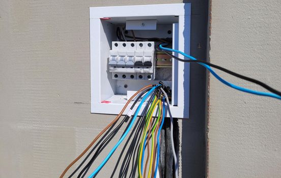 electricity distribution box with wires and circuit breakers (fuse box)