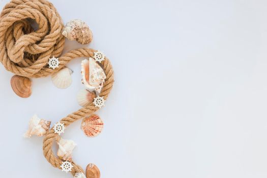 sea shells with nautical rope white table