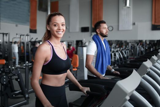 young people working at the gym in the sports centre. healthy lifestyle