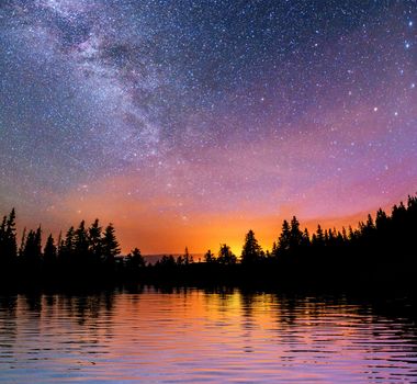 Starry sky over the sea. Fantastic Milky Way. Meteor shower. Carpathians. Ukraine, Europe