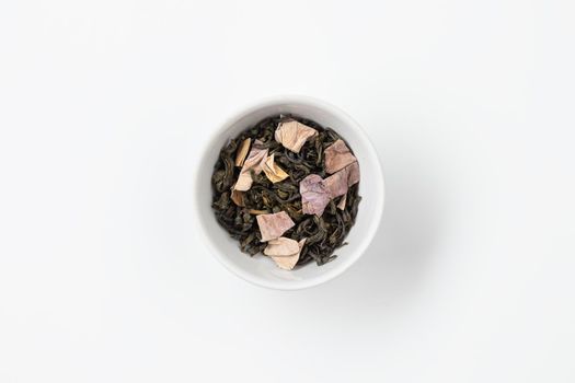 Tea in a white plate top view