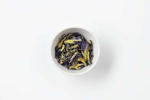 Tea in a white plate top view