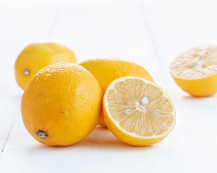 Fresh juicy lemon slices on a white background