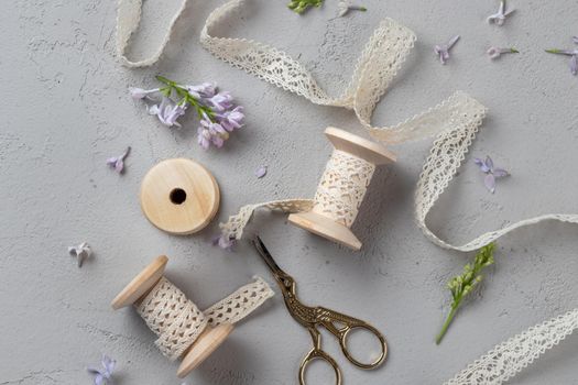Spring Grey Background with flowers and ribbons on a gray background