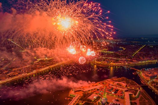 Festive salute over the Peter and Paul Fortress in a significant Victory Day for the country on May 9, improbable quantity of ships observes a show, an eternal flame of memory burns on rostral colons. High quality photo