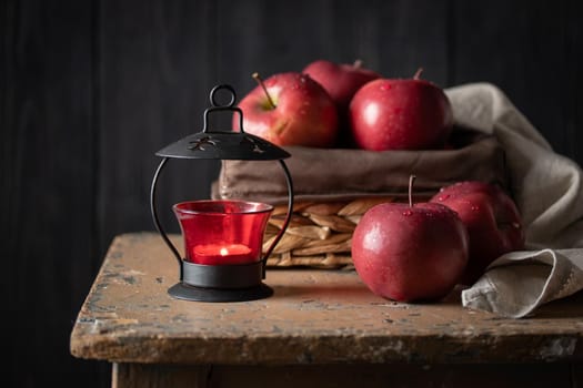 Red apples in a basket on a dark background vertical
