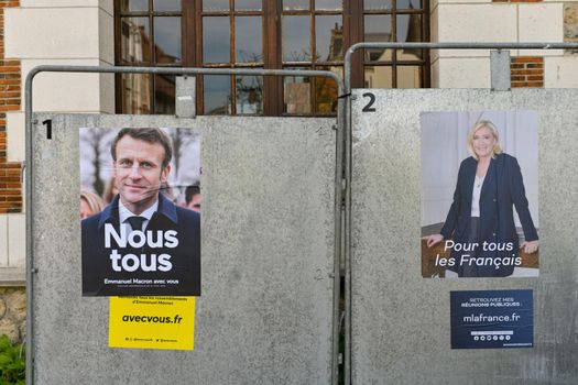 PARIS, FRANCE - APRIL 21, 2022 : The banners with candidates for President elections