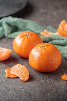 Fresh ripe citrus tangerine orange on a dark background