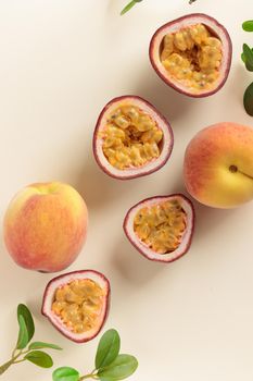 Peaches and passion fruits on a yellow background top view