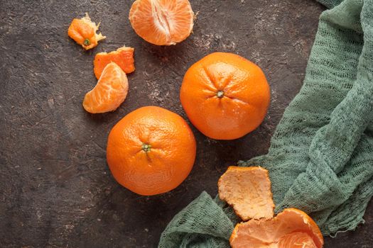 Fresh ripe citrus tangerine orange on a dark background
