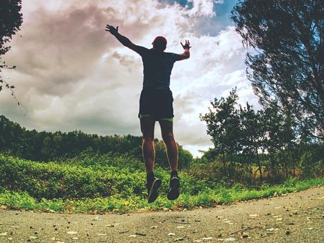 Running man. Health and fitness outdoor concept. Man is jogging in the morning. Young man doing sports