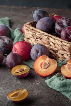 Fresh ripe plums on a dark background