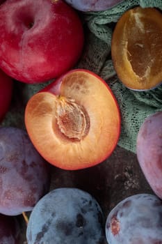 Fresh ripe plums on a dark background