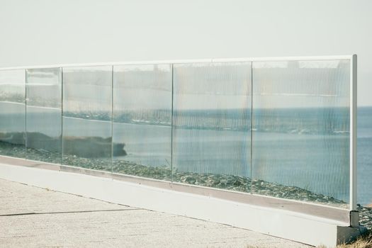 Panoramic view of the city. An observation deck with a figured fence and a lantern. City view.