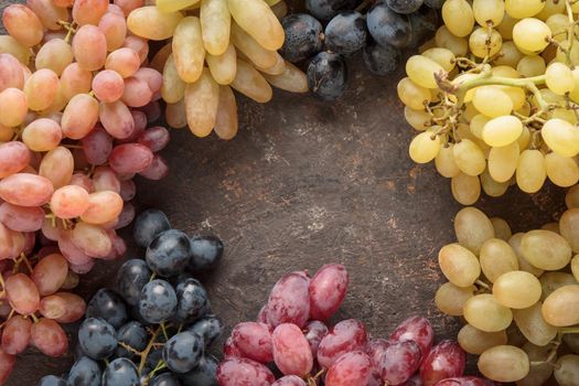 Grapes in a wooden box on a dark background