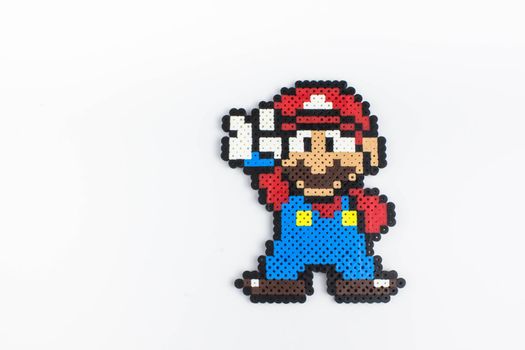 Gatineau, Quebec Canada - January 10, 2021: Perler bead handmade boy. Perler bead mario.White isolated background.