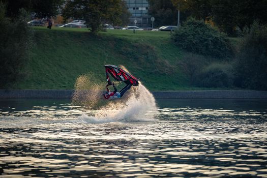 A man on a water scooter performs tricks on the water. Russia Moscow September 24, 2020.