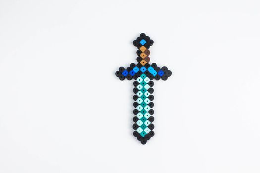 Perler bead sword. White isolated background.