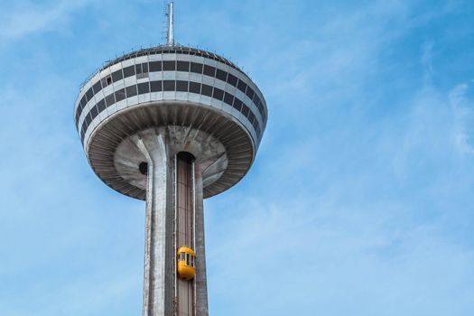 Niagara Falls, Ontario Canada - August 29, 2019: Beautiful view of skylon tower at Niagara falls with blue sky and green trees.