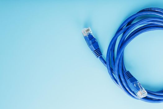 Blue UTP Internet Cable - Isolated on a blue background Ethernet Cord