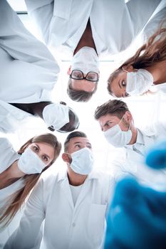 Surgical team working on a bleeding patient in a surgical room