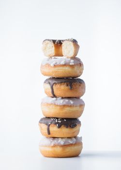 Donuts with dark and white chocolate on a white background