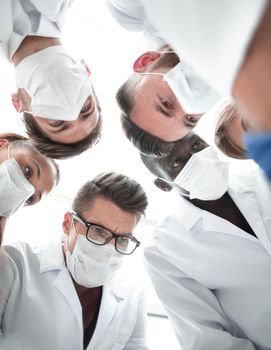 Close-up of surgeons in operative room. Medical concept