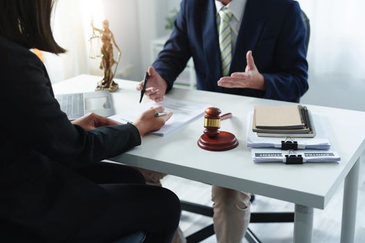 Law, Consultation, Agreement, Contract, Attorney or Lawyer holding a pen is consulting with a client to explain the pattern of answering questions before going to court to decide a lawsuit