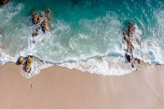 Aerial drone top view crowd of happy people relax at tropical Beach with sunset in Phuket, Thailand, Beautiful Phuket beach is famous tourist destination at Andaman sea. Holiday summer concept