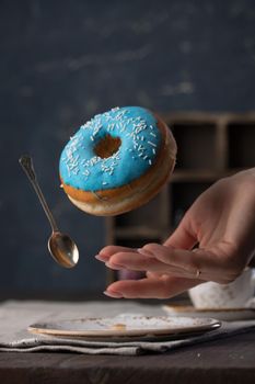 Flying blue donut on a dark background