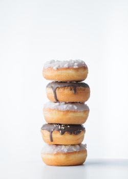 Donuts with dark and white chocolate on a white background