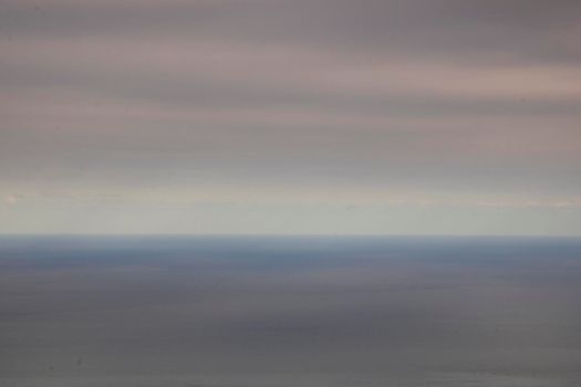 Minimalist textured seascape showing blue sea and sky