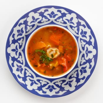 Oriental Uzbek cuisine dish in traditional plate