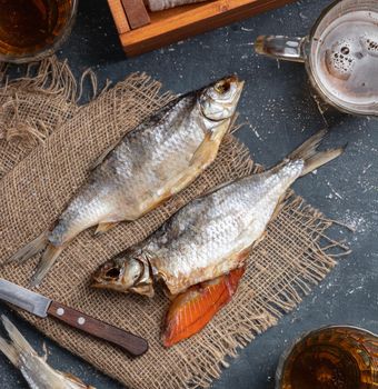 Dried caspian roach fish on a blue background