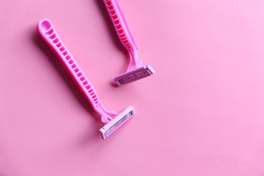 Pink Razor on pink background close up