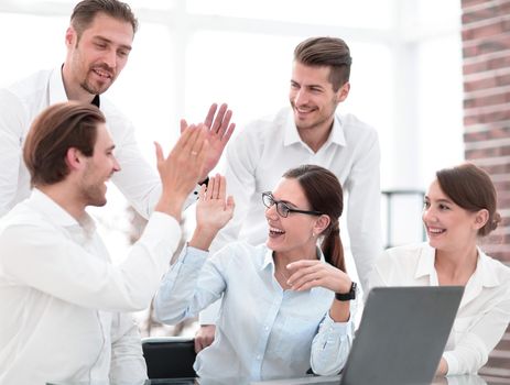 business team giving each other high five.concept of success