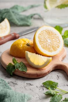 Fresh juicy lemon slices on a dark background vertical