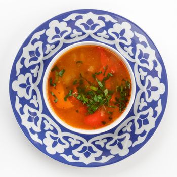 Oriental Uzbek cuisine dish in traditional plate