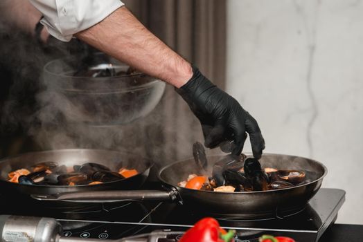 the chef prepares a seafood dish