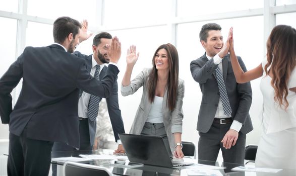 happy business team standing near office Desk.photo with copy space